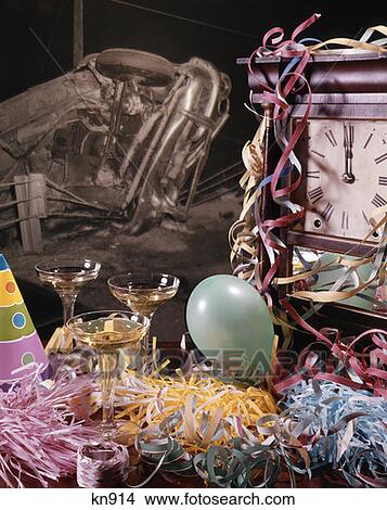 Picture - Clock Midnight Confetti Balloon Hats Party Champagne Glasses Noise Makers Car Crash Background Drink Drive Drunk. Fotosearch