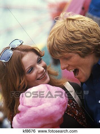 Couple Cotton Candy Man Woman Laughing 1970 1970S Laughter View Large Photo Image Stock Photograph - Couple Cotton Candy Man Woman Laughing 1970 1970S Laughter. Fotosearch