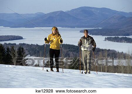 Couple Cross Country Skiing Adirondack Mountains Lake George, New York View Large Photo Image Stock Photo - Couple Cross Country Skiing Adirondack Mountains Lake George, New York. Fotosearch