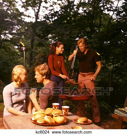 Couple Date Man Woman Picnic Playing Guitar Music Blanket 1970 1970S Retro View Large Photo Image Picture - Couple Date Man Woman Picnic Playing Guitar Music Blanket 1970 1970S Retro . Fotosearch