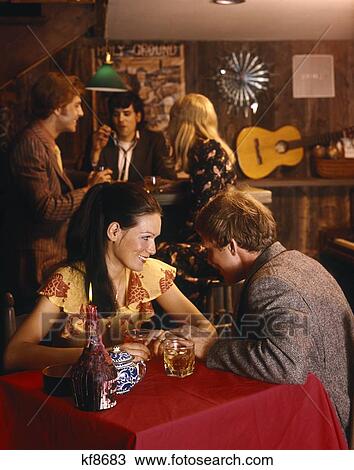 Couple Man Woman Party Talking Conversation Drinking Drinks Smiling 1970 1970S Retro View Large Photo Image Stock Image - Couple Man Woman Party Talking Conversation Drinking Drinks Smiling 1970 1970S Retro . Fotosearch