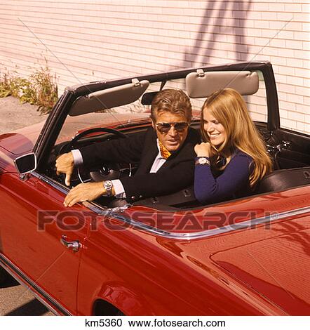 Couple Man Woman Sports Car Convertible Swingers Suave Hip 1970 1970S Retro View Large Photo Image Stock Image - Couple Man Woman Sports Car Convertible Swingers Suave Hip 1970 1970S Retro . Fotosearch