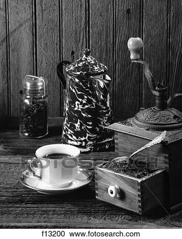 Cup Of Coffee Sitting Next To An Antique Grinder & A Jar Of Beans & A Coffee Pot View Large Photo Image Stock Image - Cup Of Coffee Sitting Next To An Antique Grinder & A Jar Of Beans & A Coffee Pot . Fotosearch