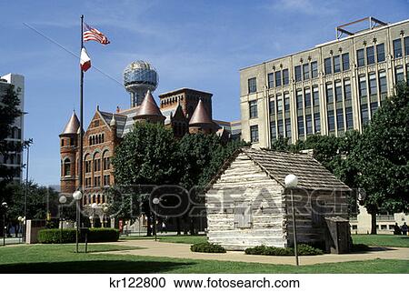 Stock Image - Dallas Tx Replica Of John Neely Bryan Cabin And Old Red Courthouse At Left . Fotosearch