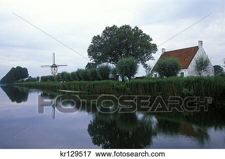 Stock Photo - Damme Belgium Windmill By Canal . Fotosearch