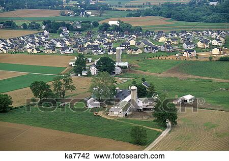 Stock Image - Development Encroaching On Farming Pennsylvania . Fotosearch