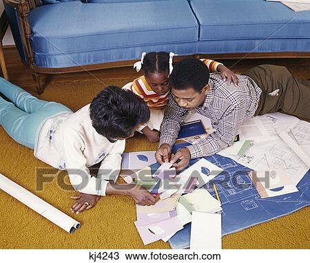 Family Looking At Color Swatches And Blueprints View Large Photo Image Stock Image - Family Looking At Color Swatches And Blueprints. Fotosearch