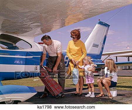 Stock Photo - Family Putting Luggage On Private Plane . Fotosearch