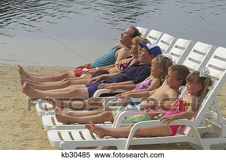 Family Sunbathing Near Water Not Available For Pocono Resort Usages View Large Photo Image Stock Photography - Family Sunbathing Near Water Not Available For Pocono Resort Usages . Fotosearch