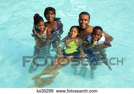 Family Swimming Together In Pool Not Available For Pocono Resort Usages View Large Photo Image Stock Photo - Family Swimming Together In Pool Not Available For Pocono Resort Usages . Fotosearch