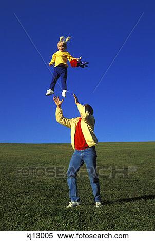 Father Tossing Daughter Up In The Air View Large Photo Image Stock Photography - Father Tossing Daughter Up In The Air . Fotosearch