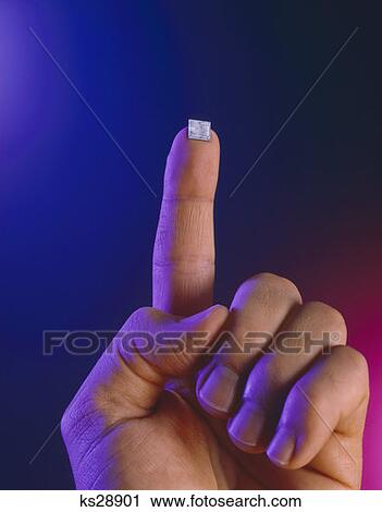 Finger Holding Micro Chip View Large Photo Image Stock Image - Finger Holding Micro Chip . Fotosearch