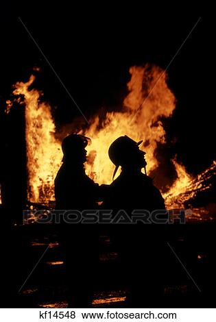 Firemen Silhouetted By Fire View Large Photo Image Stock Photo - Firemen Silhouetted By Fire . Fotosearch
