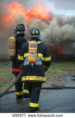 Firemen Spraying Water On Fire View Large Photo Image Stock Image - Firemen Spraying Water On Fire . Fotosearch