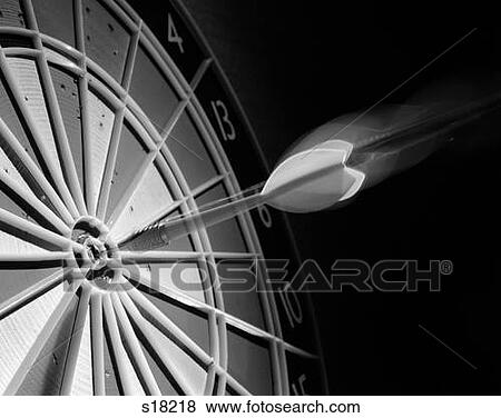 Flying Dart Hitting Bull'S-Eye On Target Dart Board Special Effect Blurred Action Symbolic Close-Up View Large Photo Image Stock Photo - Flying Dart Hitting Bull'S-Eye On Target Dart Board Special Effect Blurred Action Symbolic Close-Up . Fotosearch