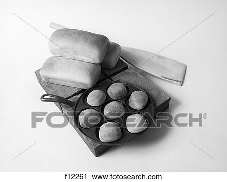 Freshly Baked Home Made Bread 3 Loaves Loaf On Cutting Board & 7 Rolls In Cast Iron Baking Pan View Large Photo Image Stock Image - Freshly Baked Home Made Bread 3 Loaves Loaf On Cutting Board & 7 Rolls In Cast Iron Baking Pan . Fotosearch