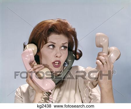 Frustrated Young Redheaded Woman Trying To Handle Five Telephone Receivers Studio View Large Photo Image Stock Photo - Frustrated Young Redheaded Woman Trying To Handle Five Telephone Receivers Studio. Fotosearch