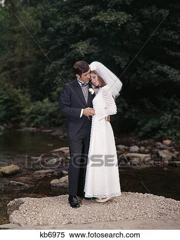 Full Length Portrait Of Bride And Groom Standing On Rock By Creek Outdoor View Large Photo Image Stock Photography - Full Length Portrait Of Bride And Groom Standing On Rock By Creek Outdoor . Fotosearch