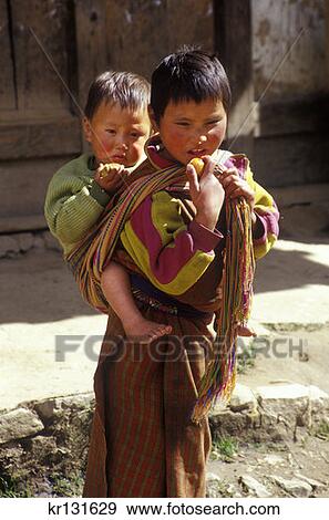 Girl Carrying Brother On Back Phobijkha Bhutan View Large Photo Image Stock Photo - Girl Carrying Brother On Back Phobijkha Bhutan. Fotosearch