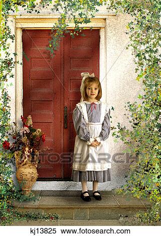 Girl Wearing Old Fashioned Blue Gingham Dress Apron And Bow In Hair Standing On Doorstep Ivy On Wall Painted Background View Large Photo Image Stock Photography - Girl Wearing Old Fashioned Blue Gingham Dress Apron And Bow In Hair Standing On Doorstep Ivy On Wall Painted Background . Fotosearch