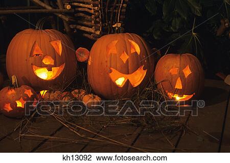 Stock Image - Halloween Still Life Carved Pumpkins Jack O Lantern On Porch . Fotosearch
