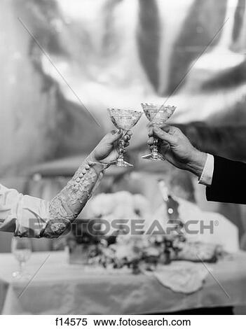 Stock Photography -  Hands & Arms Of A Bride And Groom Toasting With Champagne Glasses . Fotosearch