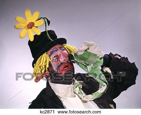 Stock Image - Hobo Style Clown Wear Top Hat With Big Daisy Crying Performer Funny . Fotosearch