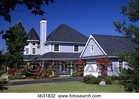 Stock Image - House And Garage With Rose Trellis. Fotosearch