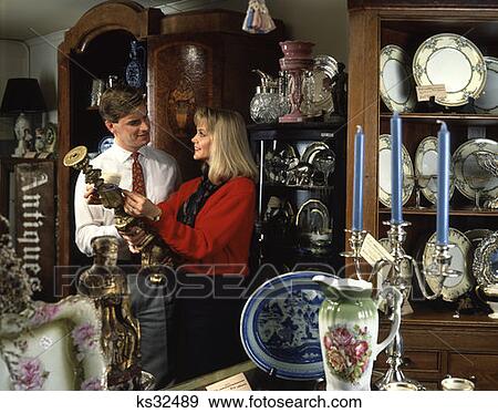 Man And Woman In Antique Shop View Large Photo Image Stock Photo - Man And Woman In Antique Shop. Fotosearch