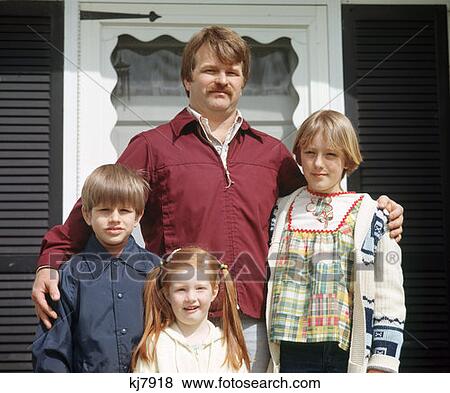 Man Children Portrait Embrace 1970 1970S Retro View Large Photo Image Stock Photo - Man Children Portrait Embrace 1970 1970S Retro . Fotosearch