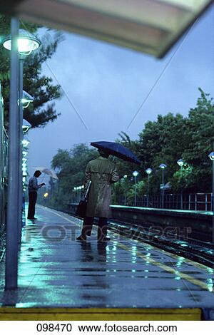 Stock Image - Man Commuter Waiting For Train . Fotosearch