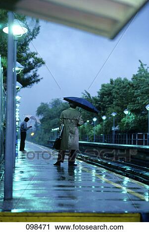 Stock Image - Man Commuter Waiting For Train . Fotosearch