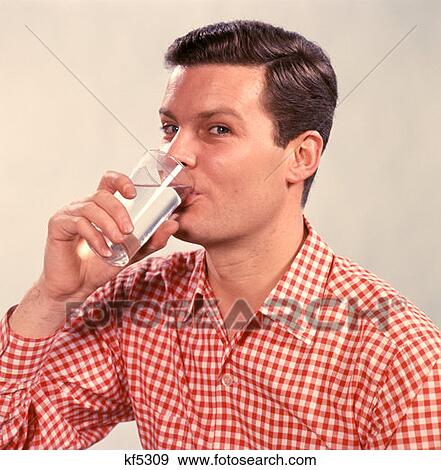 Man Drinking Glass Water Smiling Posing 1970 1970S Retro View Large Photo Image Stock Photo - Man Drinking Glass Water Smiling Posing 1970 1970S Retro . Fotosearch