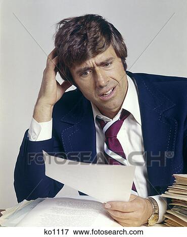Man Office Business Working Work Paperwork Confused Confusion Troubled 1970 1970S Retro View Large Photo Image Stock Photo - Man Office Business Working Work Paperwork Confused Confusion Troubled 1970 1970S Retro. Fotosearch