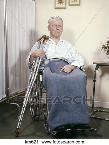 Man Wheelchair Crutches Hospital 1970 1970S View Large Photo Image Stock Image - Man Wheelchair Crutches Hospital 1970 1970S. Fotosearch