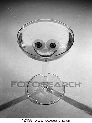 Martini Glass With Olives & Rind Lemon Positioned To Look Like A Smiley Face Happy Hour View Large Photo Image Stock Photo - Martini Glass With Olives & Rind Lemon Positioned To Look Like A Smiley Face Happy Hour . Fotosearch