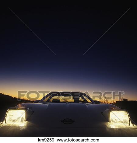 Modern Automobile Hood And Headlights Evening Dusk Driving View Large Photo Image Stock Photo - Modern Automobile Hood And Headlights Evening Dusk Driving. Fotosearch