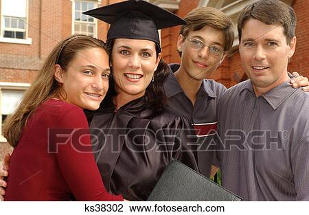 Mother Graduate Poses With Family At Graduation View Large Photo Image Stock Image - Mother Graduate Poses With Family At Graduation. Fotosearch