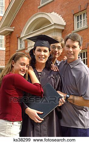 Mother Graduate Poses With Family At Graduation View Large Photo Image Stock Photo - Mother Graduate Poses With Family At Graduation. Fotosearch