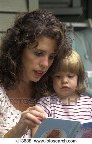 Stock Photo - Mother Reading To Toddler Daughter. Fotosearch