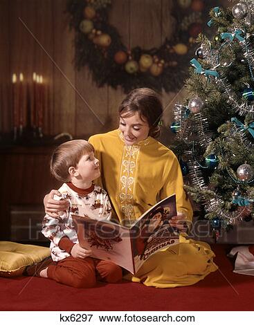 Mother & Son Reading By Christmas Tree View Large Photo Image Stock Photo - Mother & Son Reading By Christmas Tree. Fotosearch