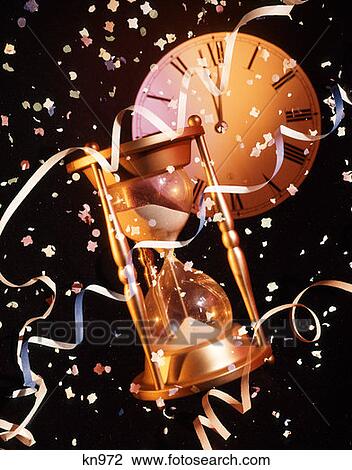 New Years Still Life Hourglass, Clock And Confetti View Large Photo Image Stock Image - New Years Still Life Hourglass, Clock And Confetti. Fotosearch