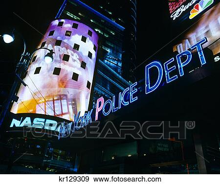 Stock Photo - New York Ny Times Square At Night Nasdaq Market Site Tower Next To Police Station . Fotosearch