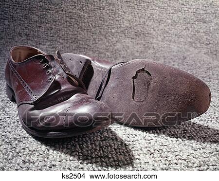 Old Shoes Used Worn Out Run Down Hole In Bottom Of Sole View Large Photo Image Picture - Old Shoes Used Worn Out Run Down Hole In Bottom Of Sole. Fotosearch