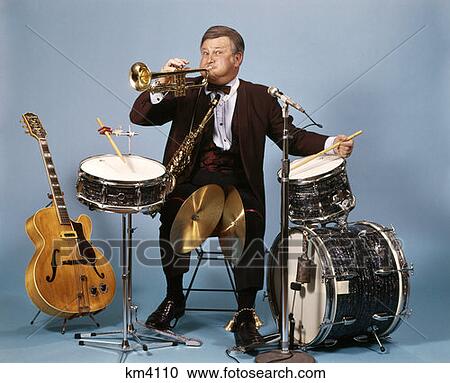 One Man Band With Drums Cymbals Trumpet Saxophone Bells And Guitar Studio View Large Photo Image Stock Image - One Man Band With Drums Cymbals Trumpet Saxophone Bells And Guitar Studio. Fotosearch