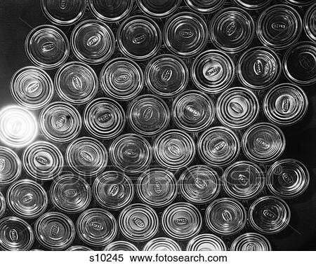 Stock Photography - Pattern Of Bottom Of Tin Cans With One Can Reflecting Light. Fotosearch