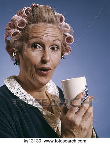 Portrait Of Woman Wearing Hair Rollers And Robe Holding Cup Of Coffee Food Beverage Symbolic View Large Photo Image Stock Image - Portrait Of Woman Wearing Hair Rollers And Robe Holding Cup Of Coffee Food Beverage Symbolic. Fotosearch
