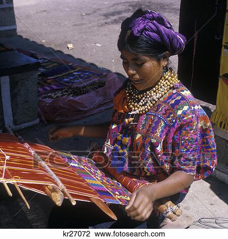 Quiche Indian Woman Weaving On Backstrap Loom With Colorful Yarns Wearing Native Costume Local Color Culture Art Craft View Large Photo Image Stock Image - Quiche Indian Woman Weaving On Backstrap Loom With Colorful Yarns Wearing Native Costume Local Color Culture Art Craft. Fotosearch