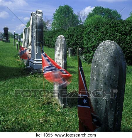 Stock Photography - Rebel Flags Marking Graves Of Confederate Soldiers In New Market Virginia Cemetery. Fotosearch
