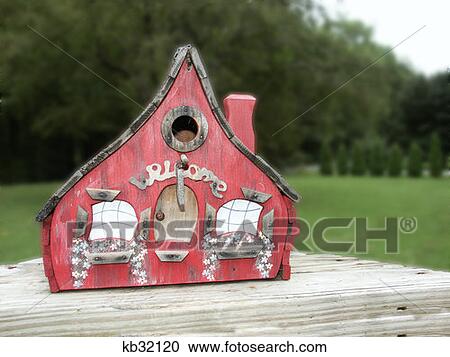 Red Painted Wooden Birdhouse With Chimney And Peaked Roof View Large Photo Image Stock Image - Red Painted Wooden Birdhouse With Chimney And Peaked Roof . Fotosearch